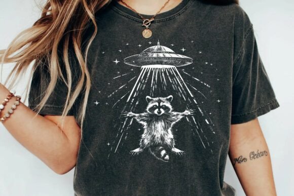 Unleash Cosmic Cuteness: The Raccoon UFO Graphic for Your Projects